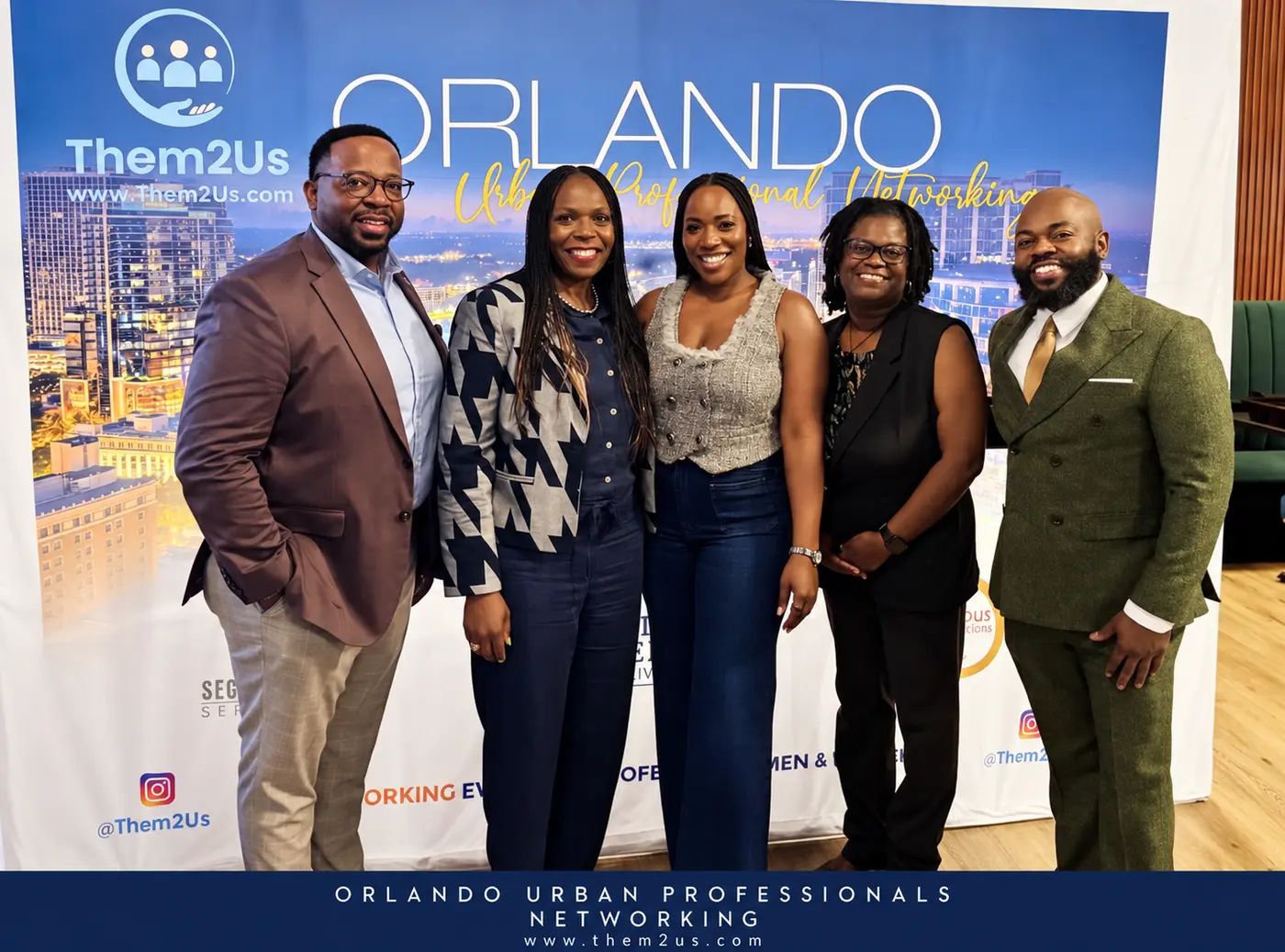 Guests at the Them2Us Orlando backdrop, Them2Us Urban Professionals Networking, Orlando, October 8, 2026