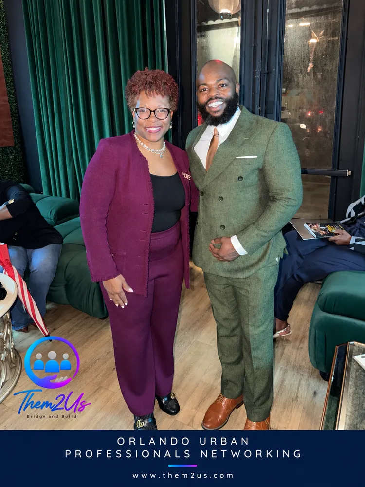 Tiffany Moore Russell, wearing a VOTE pin, with Them2Us Executive Director Jerome Lewis at Urban Professionals Networking, Allure Lounge, Orlando, October 8, 2026