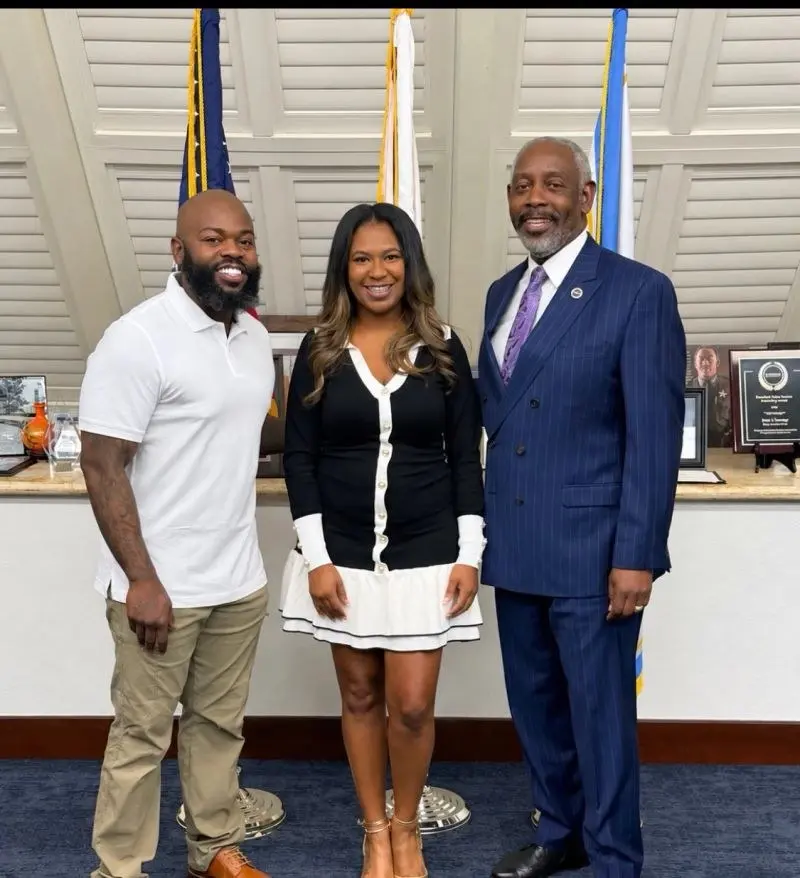 Them2Us Executive Director Jerome Lewis and board member Tiye Huertas with Orange County Mayor Jerry L. Demings