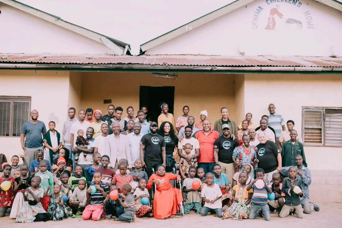 Them2Us team with children at Ukwama Children's Home, Africa