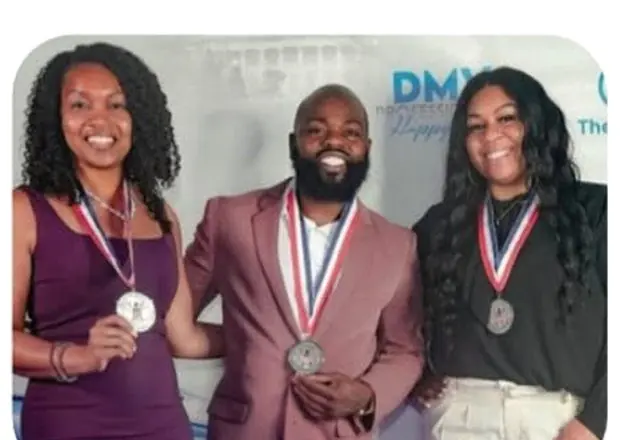 Them2Us team members with President's Volunteer Service Award medals